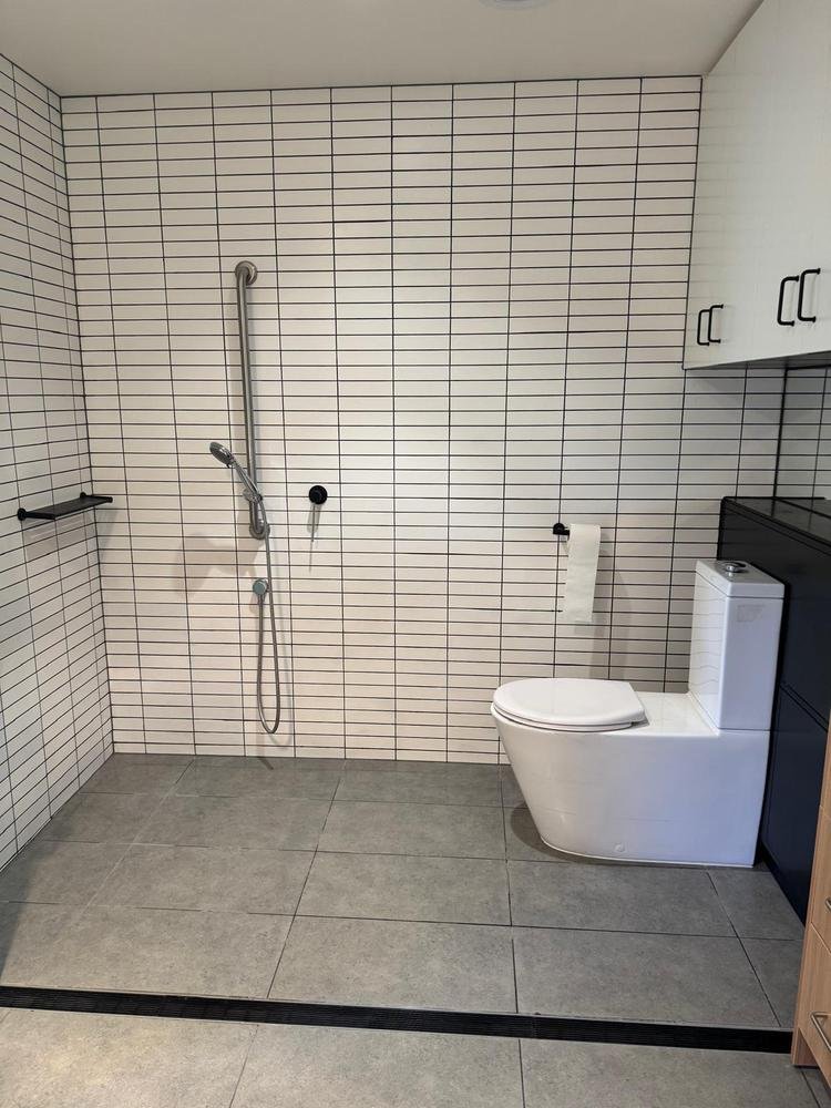 White tiled bathroom after cleaning