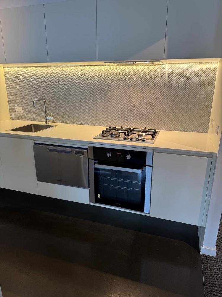 Kitchen benchtop, splashback and cooktop after cleaning