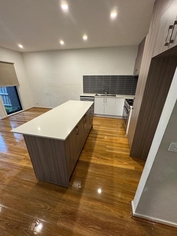Kitchen island and polished timber floor after cleaning