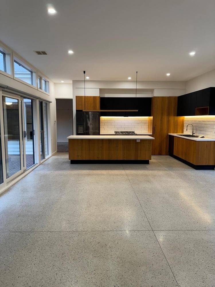 Open-plan kitchen and polished concrete floor after cleaning