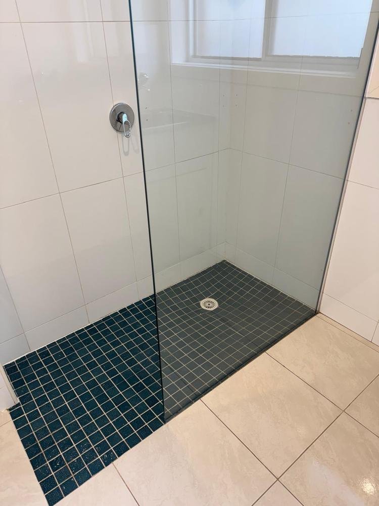 Shower recess and mosaic floor after cleaning