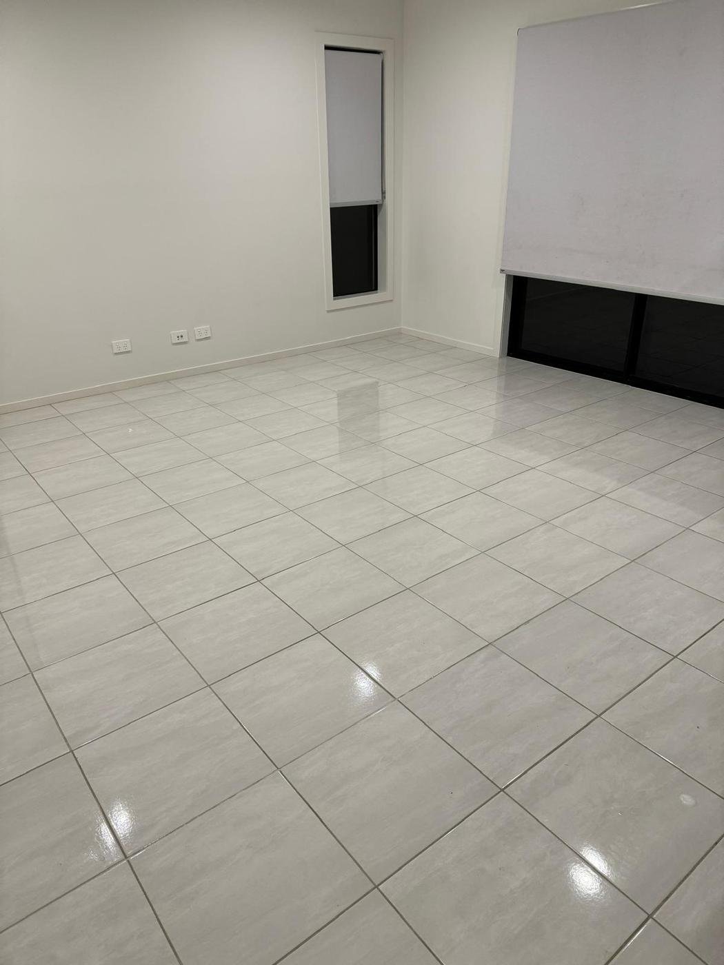 Tiled living area floor after cleaning